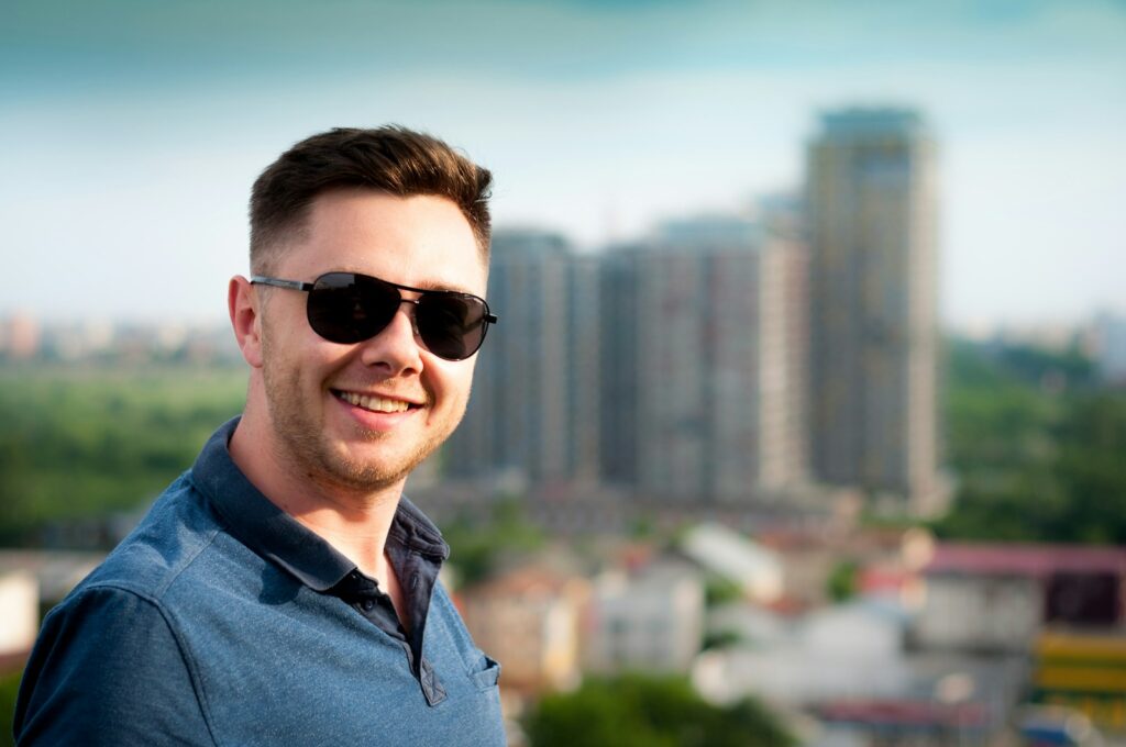 How to Start Content Writing and Get Paid for Your Words 1 man wearing blue polo shirt with building background