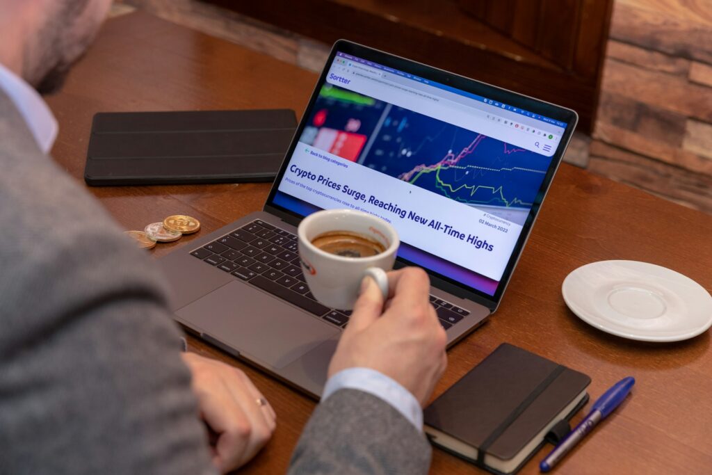 Earn Extra Cash as a Remote Customer Service Rep 1 a man sitting at a table with a laptop and a cup of coffee